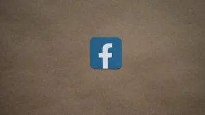 a blue facebook logo on a brown background