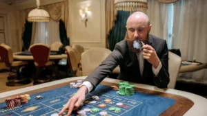 Bald bearded man in suit smoking pipe, bets at poker table inside luxurious casino.
