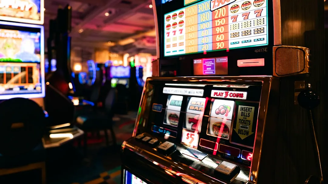 Slot machines in a dimly lit casino hall