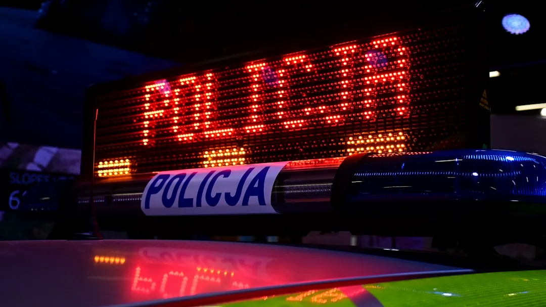 a close up of a police car sign