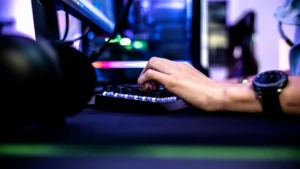 a person is typing on a laptop computer