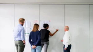 man in blue dress shirt and woman in black long sleeve shirt